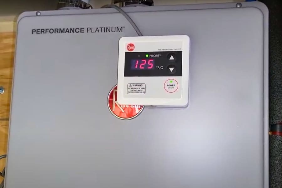 Powered-up Rheem electric tankless water heater with complete electrical connections